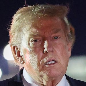 MILDENHALL, ENGLAND - JULY 08: U.S. President Donald Trump gestures as he steps off Air Force One to board the new Qatari-gifted Boeing plane, enroute to the United States following his participation in the NATO Summit at Royal Air Force Mildenhall on July 08, 2026 in Mildenhall, England. According to Trump, he departed the NATO Summit in Turkey onboard the previous Air Force One aircraft to allow U.S. service members stationed at RAF Mildenhall to tour the new Qatari-gifted Air Force One. (Photo by Win McNamee/Getty Images)
