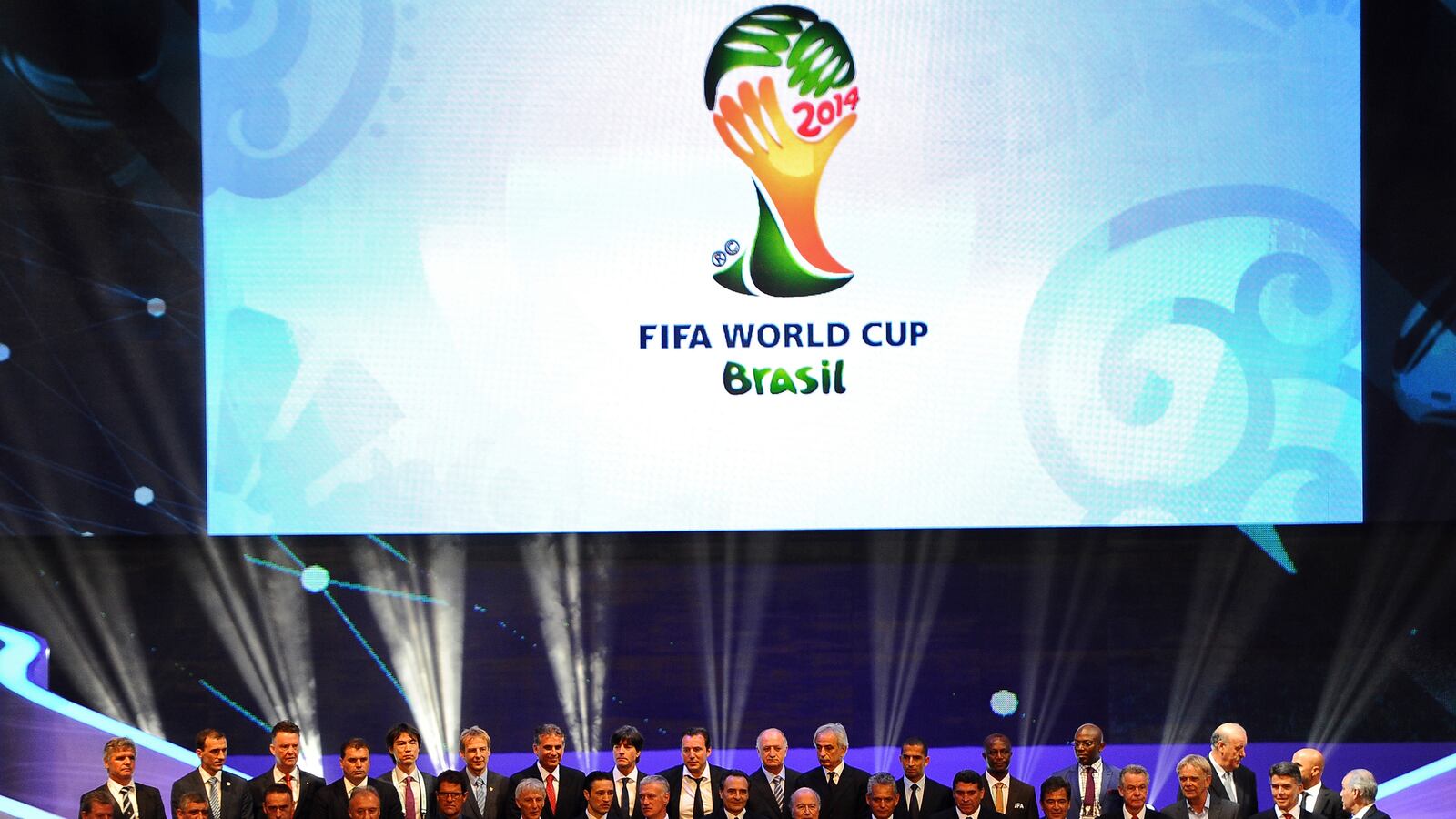 articles/2013/12/06/inside-the-world-cup-draw-devastating-for-the-u-s-great-for-brazil/131206-world-cup-tease_zyhxrn