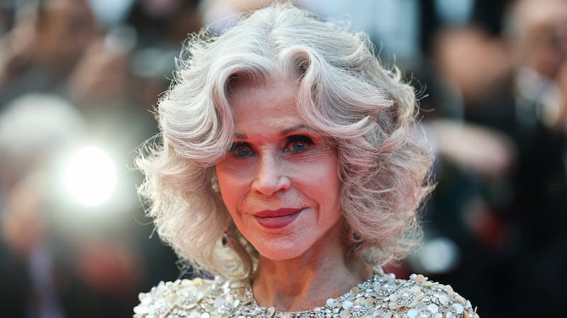 Jane Fonda poses on the red carpet as she arrives to attend the closing ceremony of the 78th Cannes Film Festival
