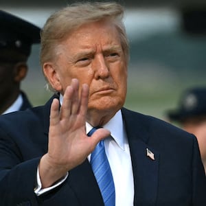 President Donald Trump waves after stepping off Air Force One at Joint Base Andrews, Maryland on August 28, 2026. US President Donald Trump traveled to Houston, Texas, to headline a Republican National Committee (RNC) fundraiser supporting Ken Paxton's US Senate campaign and to present the Artemis II crew with the Congressional Space Medal of Honor for their historic mission around the Moon.