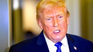 U.S. President Donald Trump speaks to reporters onboard Air Force One, on travel from West Palm Beach, Florida, to Joint Base Andrews, Maryland, U.S., February 16, 2026.