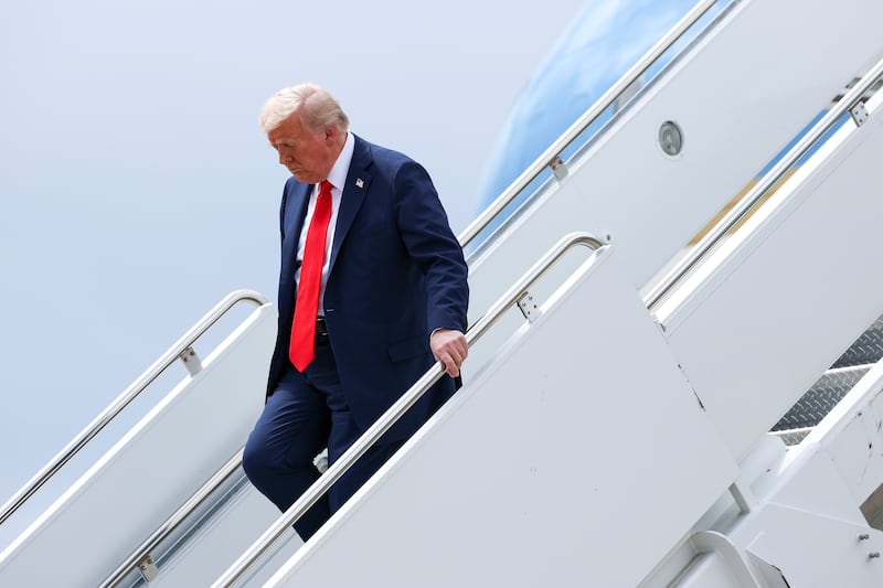 President Donald Trump steps off Air Force One at attend a memorial service for political activist Charlie Kirk at State Farm Stadium, on September 21, 2025 in Glendale, Arizona.