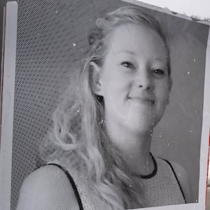 MINNEAPOLIS, MINNESOTA - JANUARY 16: A poster featuring Renee Good sits along the street near a memorial to Good on January 16, 2026 in Minneapolis, Minnesota. Protests have sparked up around the city after a federal agent fatally shot Good in her car during an incident in south Minneapolis on January 7. (Photo by Scott Olson/Getty Images)