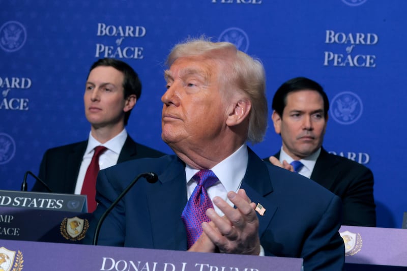 President Donald Trump looks on during the applause at his "Board of Peace" meeting where he was repeatedly captured on camera with his eyes closed as others spoke on February 19, 2026.