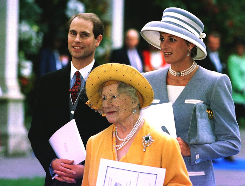 The Princess of Wales (R) stands with the Queen Mother and Prince Edward October 8, 1993.