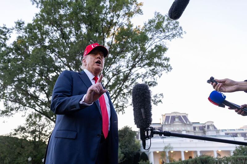 Framed portraits of US President Donald Trump flank a image of former US President Joe Biden's signature and an autopen along "The Presidential Walk of Fame" on the wall of the colonnade outside of the Oval Office at the White House on October 5, 2025 in Washington, DC. Trump is headed to Norfolk to attend the US Navy's 250th anniversary celebrations. (Photo by ANDREW CABALLERO-REYNOLDS / AFP) (Photo by ANDREW CABALLERO-REYNOLDS/AFP via Getty Images)