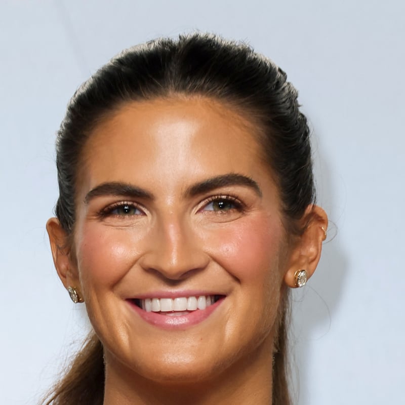 Kaitlan Collins at the Vanity Fair Oscars party this year: Smiling.