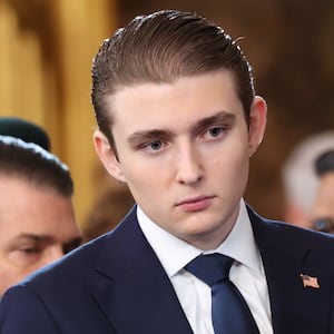 Barron Trump looks on as U.S. Democratic Leader Chuck Schumer waves to a guest during inauguration ceremonies in the U.S. Capitol Rotunda on January 20, 2025 in Washington, DC. Donald Trump takes office for his second term as the 47th president of the United States.
