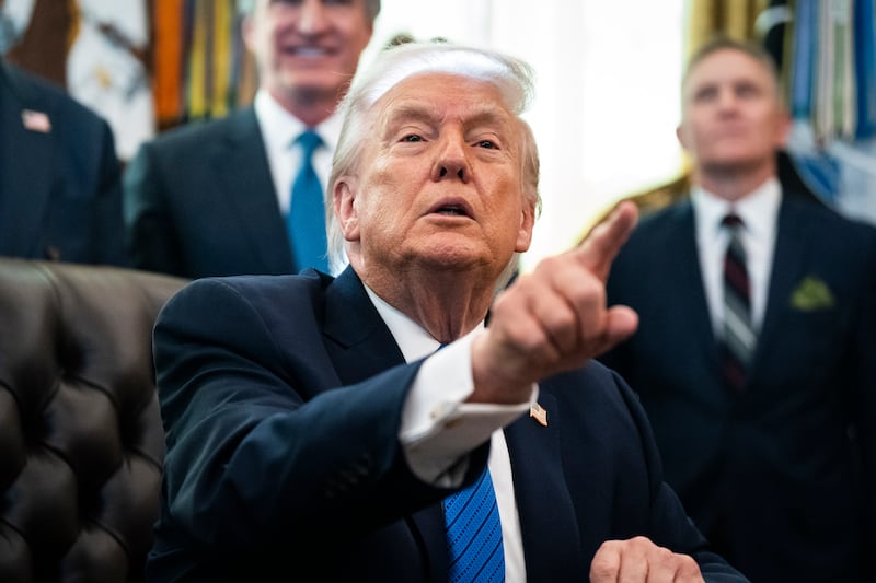 President Donald J Trump speaks to reporters before signing an Executive Order about IndyCar races in the District of Columbia this summer for America's 250th birthday, in the Oval Office at the White House on Friday Jan. 30, 2026, in Washington, DC.