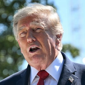 President Donald Trump speaks to the press about ongoing construction of a helipad and other projects on the South Lawn of the White House in Washington, DC, on August 19, 2026.