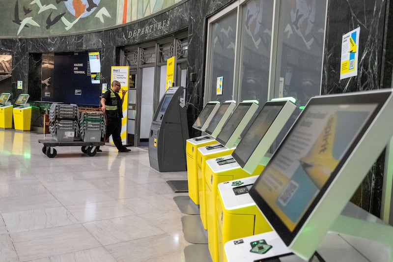 Check-in kiosks informed passengers at LaGuardia Airport of Spirit's shutdown.