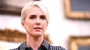 Natalie Harp, special assistant and executive assistant to US President Donald Trump, listens as President Trump speaks before signing executive orders releated to beef processing and cattle ranchers, in the Oval Office of the White House in Washington, DC, on September 4, 2026.