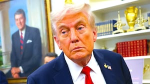 President Donald Trump listens to a question from a reporter after announcing a deal with Pfizer to lower Medicaid drug prices in the Oval Office of the White House on September 30, 2025 in Washington, DC. T