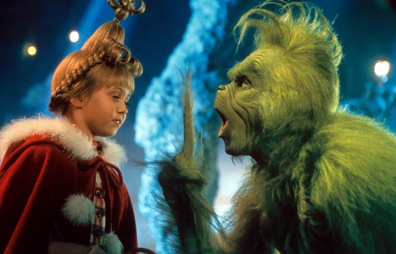 Taylor Momsen listening to Jim Carrey in a scene from the film 'How The Grinch Stole Christmas', 2000.