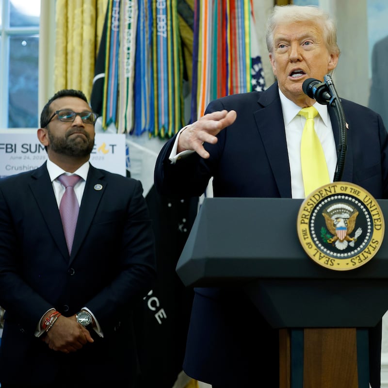 U.S. President Donald Trump speaks as Federal Bureau of Investigation Director Kash Patel (L) and U.S. Attorney General Pam Bondi look on during a press conference in the Oval Office of the White House on October 15, 2025 in Washington, DC.