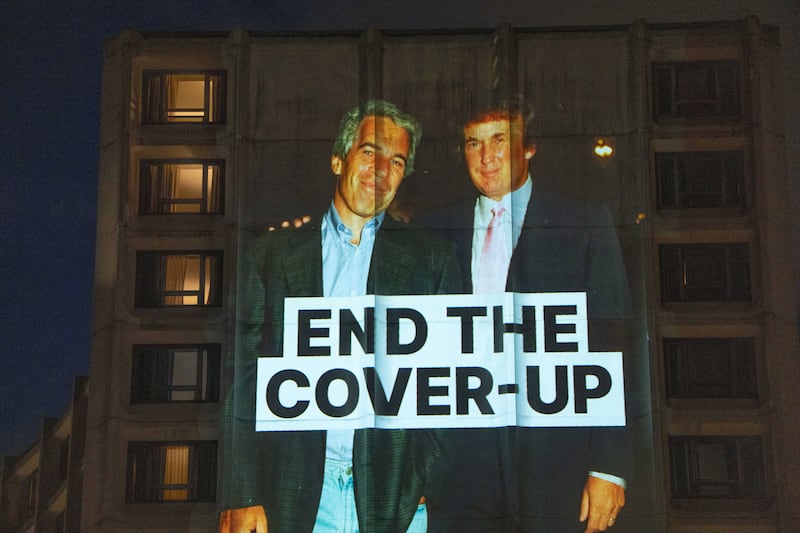 A photo of late financier and convicted sex offender Jeffrey Epstein and U.S. President Donald Trump is projected onto the Washington Hilton in Washington, D.C., U.S., April 24, 2026. REUTERS/Aaron Schwartz