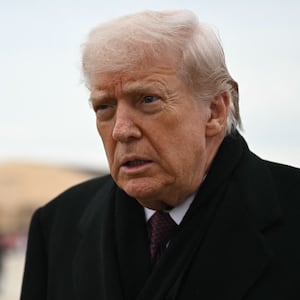 US President Donald Trump speaks to reporters after stepping off Air Force One at Joint Base Andrews on December 17, 2025 upon return from Dover Air Force Base in Delaware where he attended a ceremony for the return of the remains of two Iowa National Guard members and a translator killed in an attack in Syria.