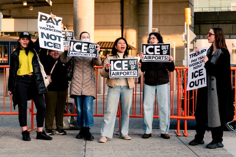 People protest ICE presence outside Terminal 4 at John F. Kennedy International Airport in New York, on March 25, 2026. US Immigration and Customs Enforcement (ICE) at the center of a firestorm over heavy-handed enforcement tactics began deploying Monday to major airports, as officials scrambled to ease mounting travel disruption during a prolonged, partial government shutdown. (Photo by Angelina Katsanis / AFP via Getty Images)