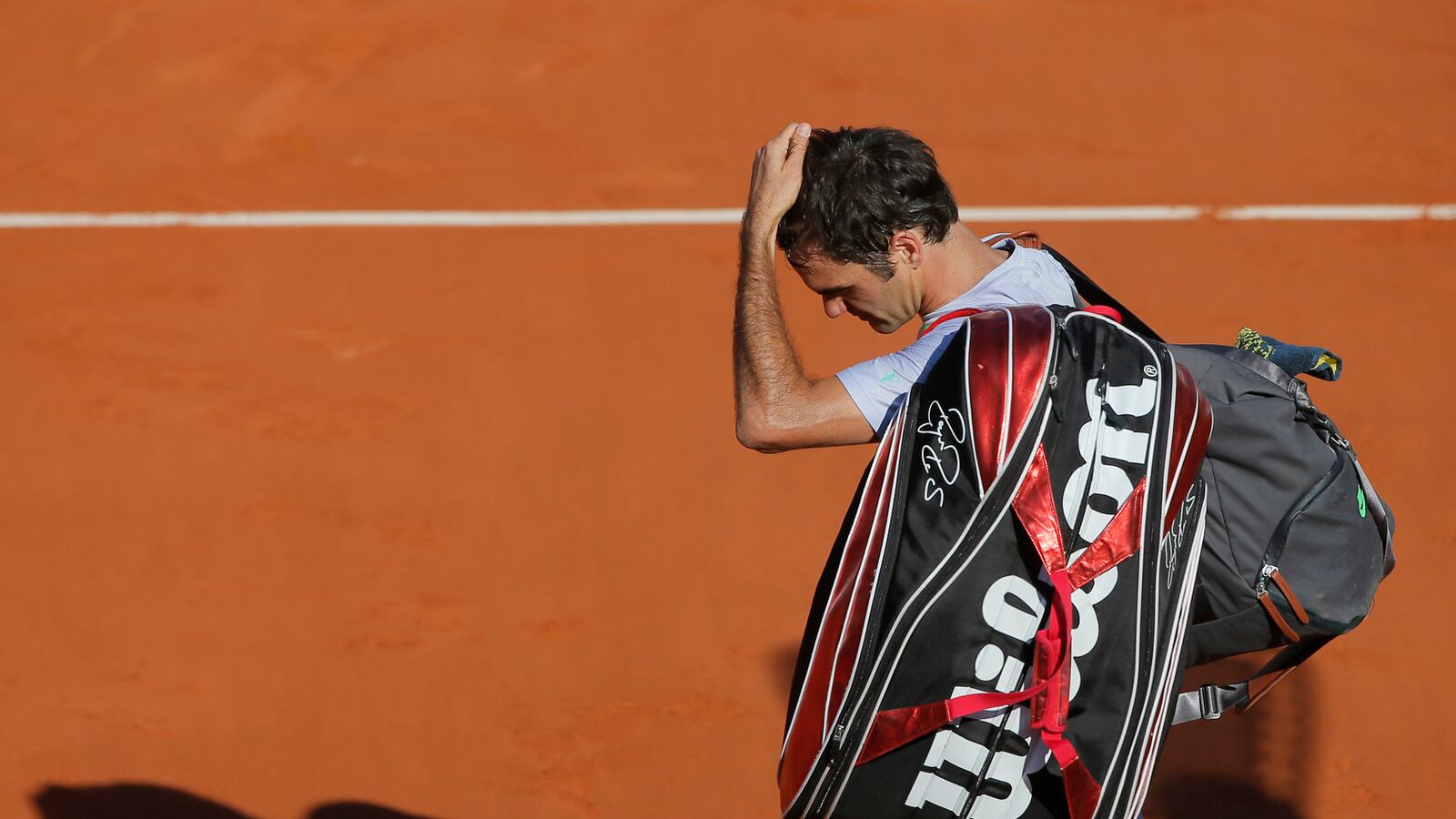 galleries/2013/06/09/roger-federer-a-history-in-hair-days-photos/130607-federer-hair-days-01-tease_vlcfvg