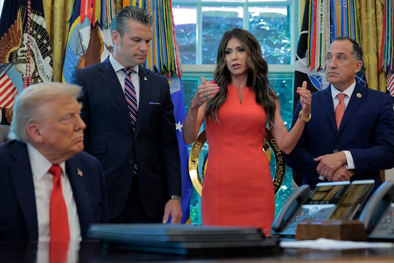 U.S. President Donald Trump is joined by (2nd L-R) Defense Secretary Pete Hegseth, Homeland Security Secretary Kristi Noem and U.S. Marshal Service Director Gadyaces Serralta.