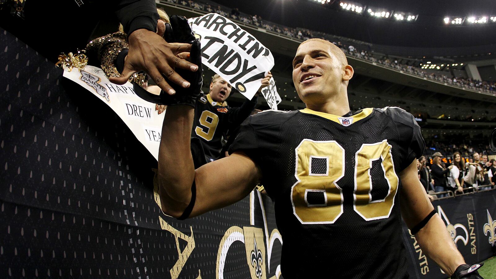 New Orleans Saints tight end Jimmy Graham is congratulated by fans after his team defeated the Carolina Panthers in 2012.