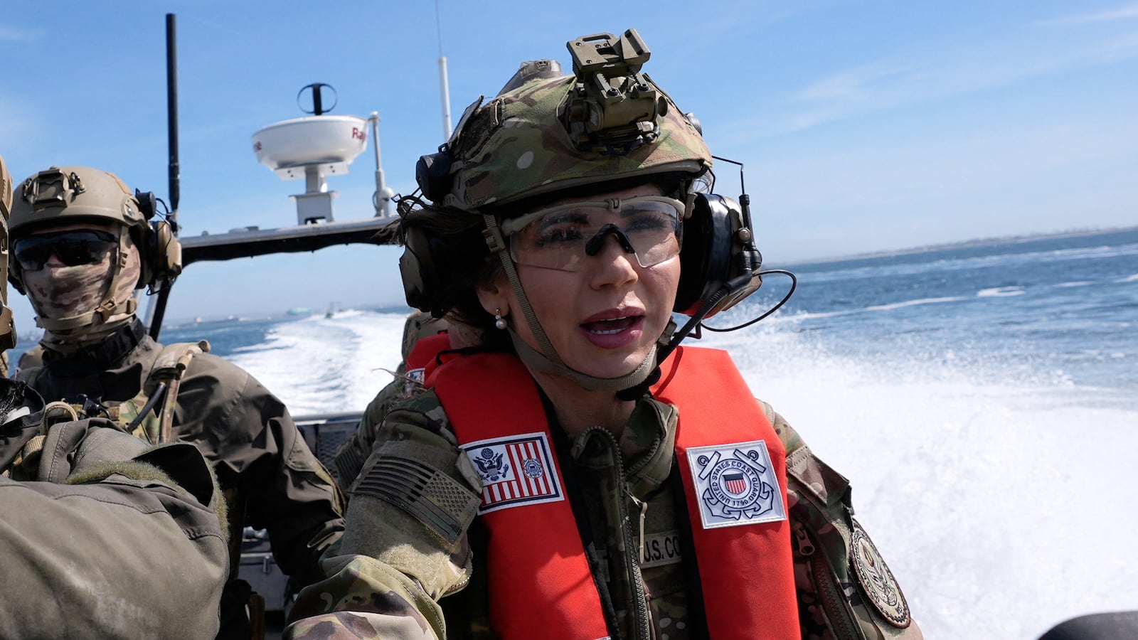 US Secretary of Homeland Security Kristi Noem (R) pilots a US Coast Guard Response Boat-Small (RBS) with the Maritime Security Response Team in San Diego, California, on March 16, 2025.
