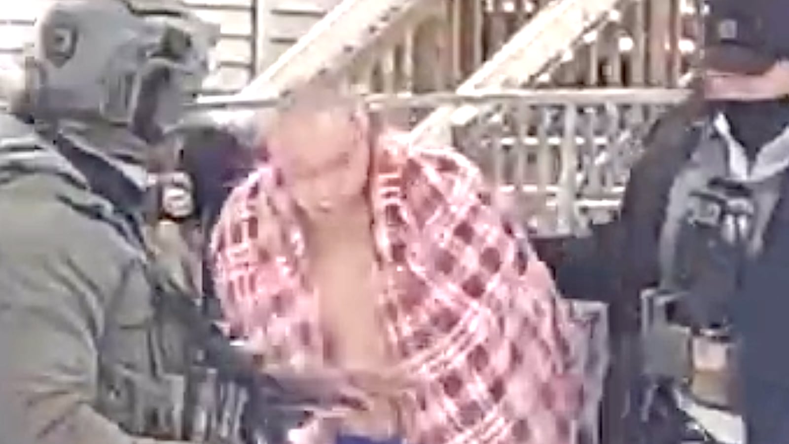 ChongLy “Scott” Thao is dragged of his house, wearing just underwear, by ICE agents into the snow.