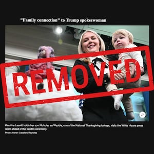 A screen grab from Tages-Anzeiger of the photo of Karoline Leavitt with her son Nicholas, and Waddle, one of the National Thanksgiving turkeys, in the press briefing room of the White House, prior to the turkey pardoning ceremony with President Donald Trump on Nov. 25, 2025, in Washington, DC., before being pulled by the AFP.
