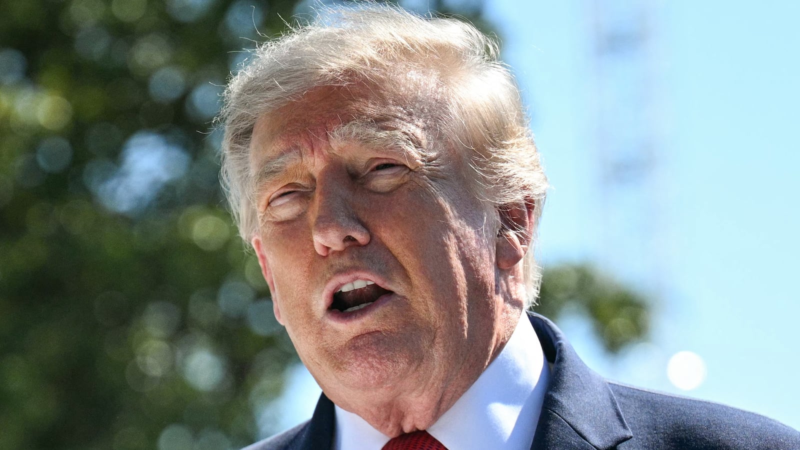 President Donald Trump speaks to the press about ongoing construction of a helipad and other projects on the South Lawn of the White House in Washington, DC, on August 19, 2026.