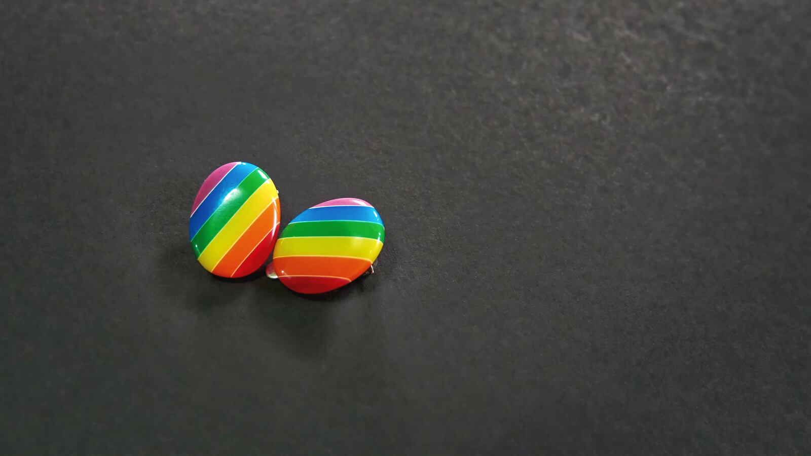 Rainbow colored earrings.