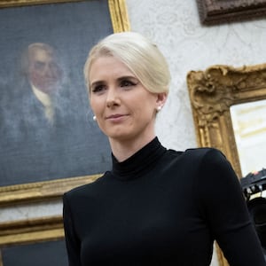 Executive Assistant to the President Natalie Harp, 34, stands in the Oval Office on March 31.