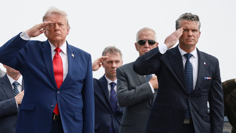 U.S. President Trump and U.S. Secretary of Defense Pete Hegseth salute during a dignified transfer of the remains of U.S. Army service members, Army 1st Lt Tyler James Feehan, Sgt. Angel S. Rampersad, Pvt. Isabella Gonzales, killed during an attack on Muwaffaq Salti Air Base in Jordan, and Sgt. Michael Emmanuel Swinton, killed in action during a controlled detonation of a downed one-way unmanned aerial system at Erbil Air Base in Iraq, at Dover Air Force Base in Dover, Delaware, U.S., July 22, 2026. REUTERS/Evelyn Hockstein