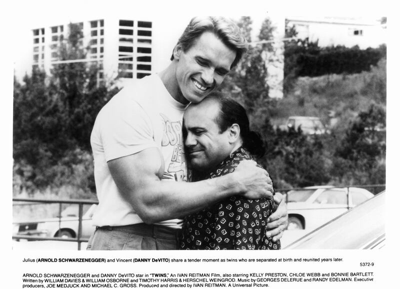 Arnold Schwarzenegger embraced Danny DeVito in a black-and-white film still from 'Twins.'