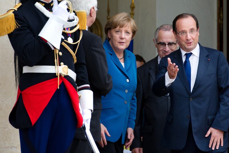 articles/2012/07/18/weird-euro-facts/merkel-euro-zone-emergency-meeting-cheat_vn42bx