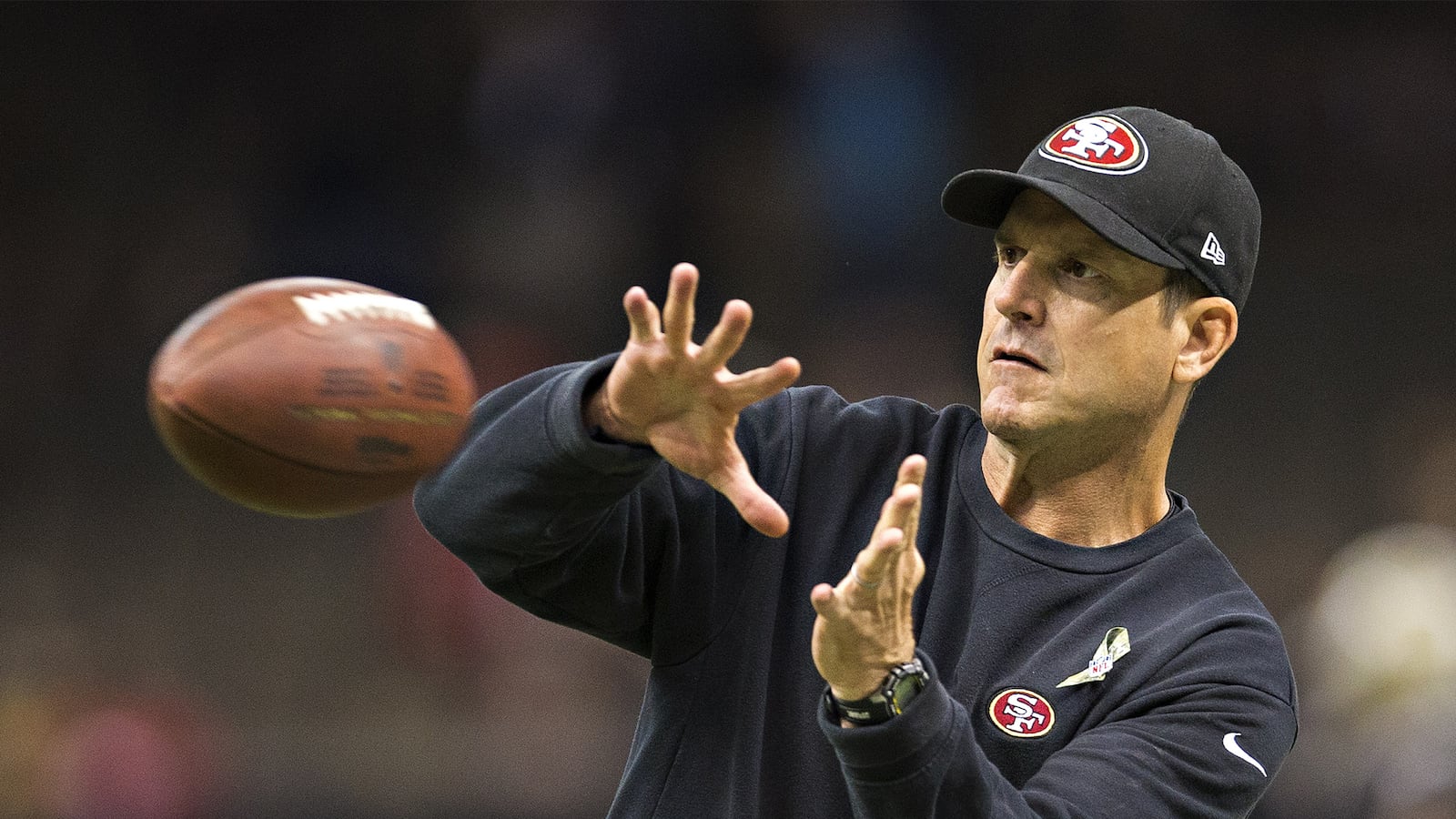 articles/2014/12/20/is-any-college-football-coach-worth-60-million-jim-harbaugh-is/141219-lawrence-jim-harbaugh-tease_awllsm