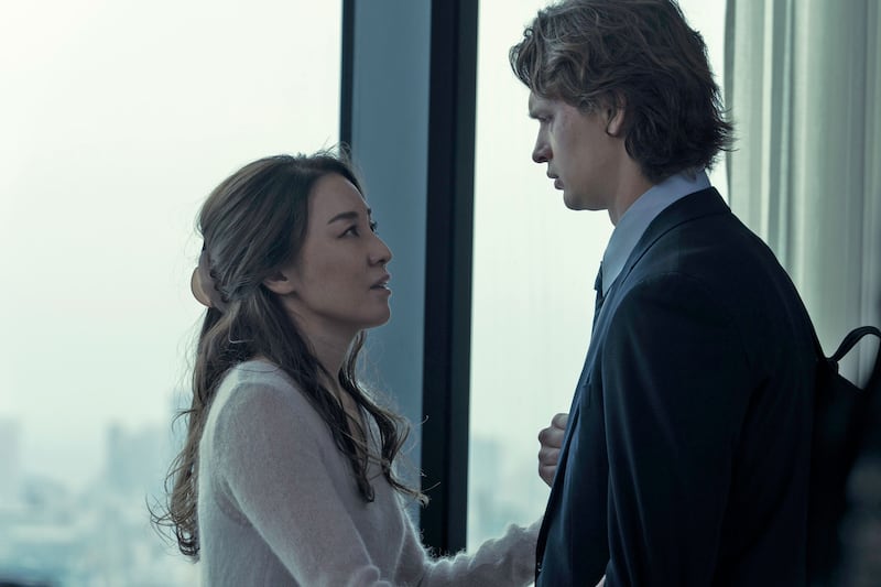 Ayumi Ito and Ansel Elgort look at each other in a still from 'Tokyo Vice'