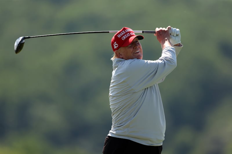 President Donald Trump golfing at Trump National Golf Club.