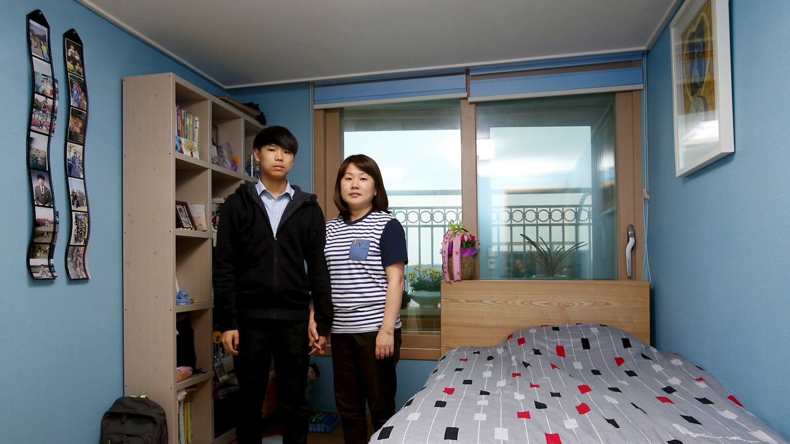 galleries/2015/04/16/one-year-after-the-korean-ferry-disaster-photos/150414-ferry-victims-families-tease_kgcvie