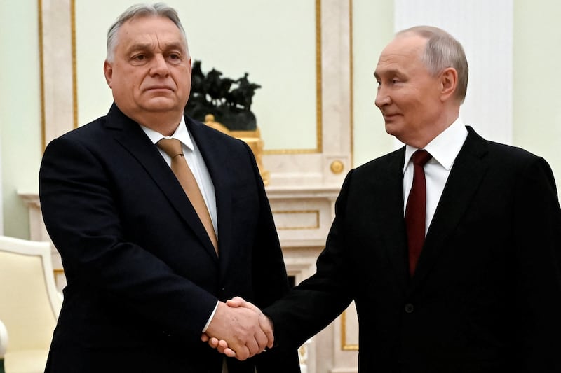 Russian President Vladimir Putin shakes hands with Hungarian Prime Minister Viktor Orban during a meeting in Moscow, Russia, November 28, 2025.