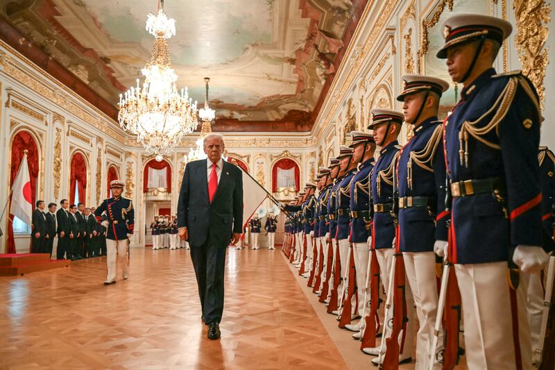 President Donald Trump reviews an honour guard composed of members of the Japan Self-Defense Force at the Akasaka State Guest House in Tokyo on October 28, 2025.