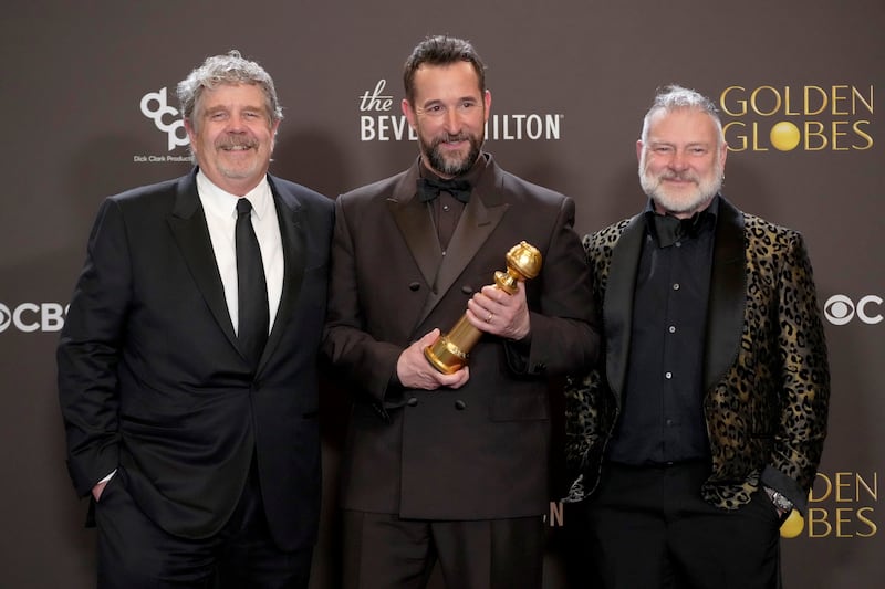 John Wells, Noah Wyle, and R. Scott Gemmill, winners of the Best Television Series - Drama Award for "The Pitt," at the 83rd Annual Golden Globe Awards.