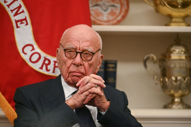 Rupert Murdoch looks as US President Donald Trump speaks to the press after signing an executive order to create a US sovereign wealth fund, in the Oval Office of the White House on February 3, 2025, in Washington, DC. (Photo by Jim WATSON / AFP) (Photo by JIM WATSON/AFP via Getty Images)