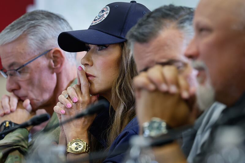 KERRVILLE, TEXAS - JULY 11: Secretary of Homeland Security Kristi Noem participates in a round table event with President Donald Trump at the Hill Country Youth Event Center to discuss last week's flash flooding on July 11, 2025 in Kerrville, Texas. Trump traveled to Texas one week after flash flooding along the Guadalupe River swept through cities, mobile home parks and summer camps, killing 120 people. Ninety-six of those killed were in Kerr County, where the toll includes at least 36 children. (Photo by Chip Somodevilla/Getty Images)