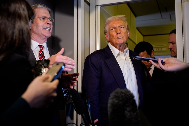IN FLIGHT - OCTOBER 27: U.S. Treasury Secretary Scott Bessent (L), accompanied by U.S. President Donald Trump and U.S. Trade Representative Jamieson Greer (R), speaks to members of the media aboard Air Force One on October 27, 2025, in flight. Trump is in route to Japan after attending the Association of Southeast Asian Nations (ASEAN) summit in Malaysia, and will travel on to South Korea for the Asia-Pacific Economic Cooperation (APEC) forum. (Photo by Andrew Harnik/Getty Images)