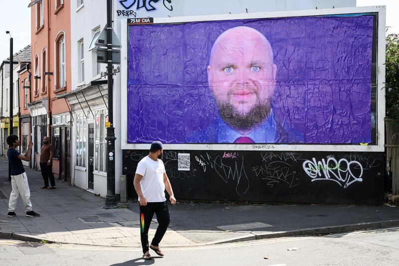CHELTENHAM, OXFORDSHIRE - AUGUST 12: A poster by the "Everyone Hates Elon" protest group depicting a satirical image of US Vice-President JD Vance is displayed after being unofficially installed on a billboard on August 12, 2025 in Cheltenham, Oxfordshire.  Following US President Donald Trump's recent holiday in Scotland, Vice President JD Vance and his family are spending their summer vacation in Chipping Norton in the Cotswolds. The idyllic, rural village is home to the former British Prime Minister David Cameron. Locals have been unprepared for the level of security disruption as roads are closed around the Vances' 6-acre country estate, and elderly people have been stopped from walking in the countryside by police. (Photo by Leon Neal/Getty Images)