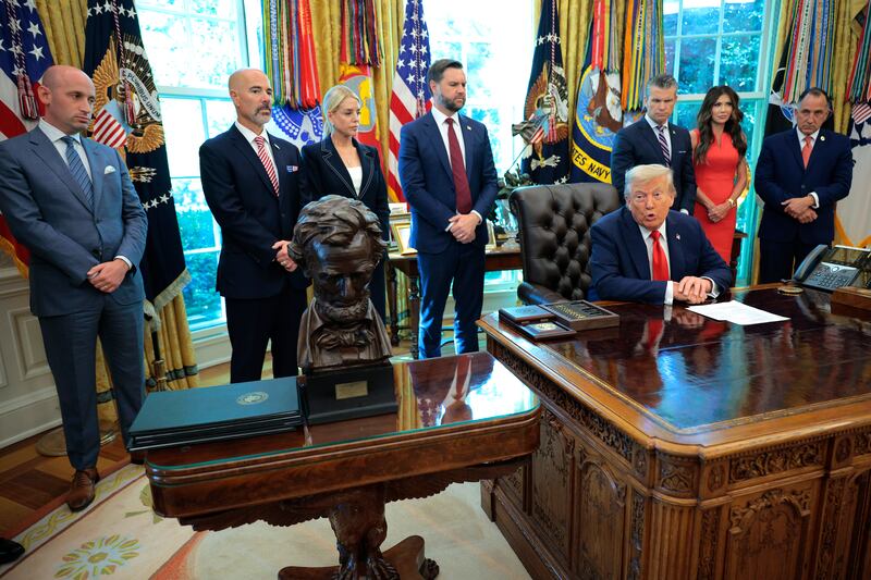 U.S. President Donald Trump speaks as he signs a series of executive Orders in the Oval Office