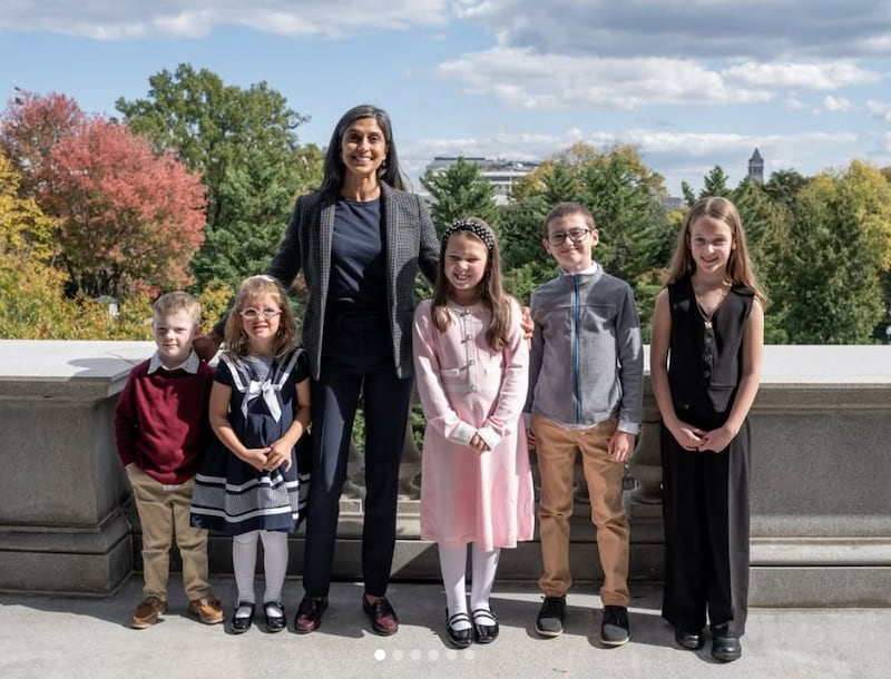 Usha Vance's poses with winners of her reading challenge project.