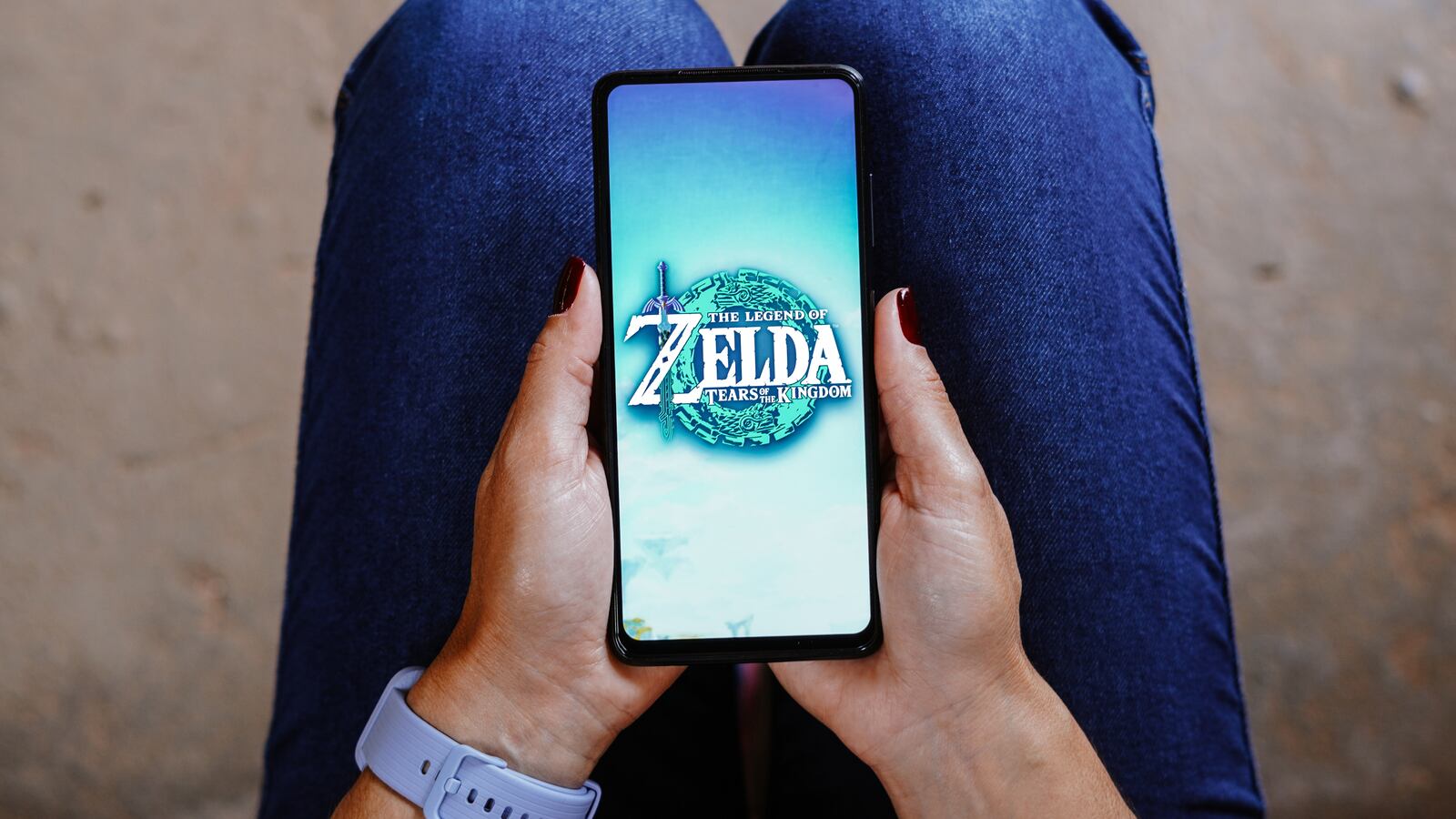 In this photo illustration, the Legend of Zelda: Tears of the Kingdom logo is displayed on a smartphone screen.