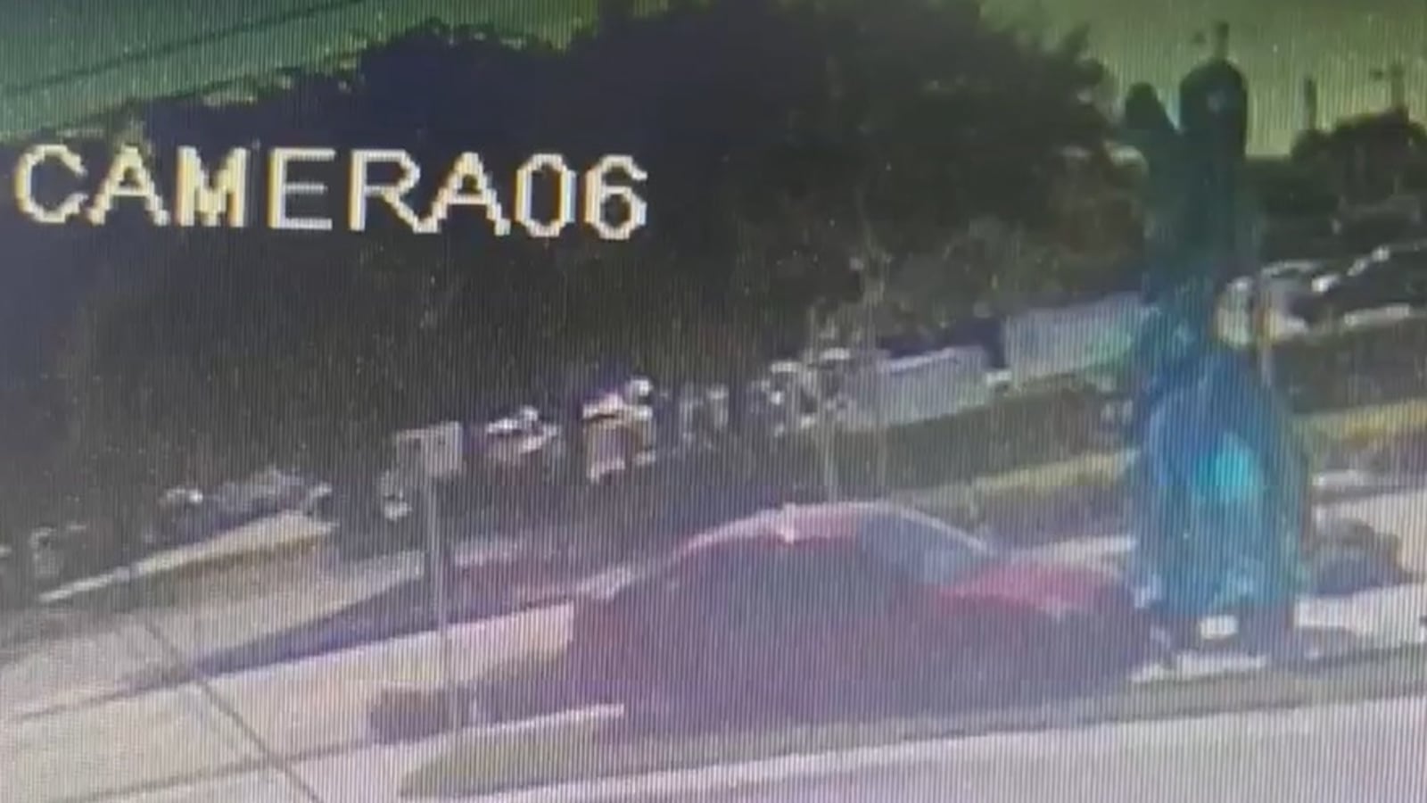 A screenshot of surveillance footage showing Derek Alan Modrok crashing his car into the sculpture.