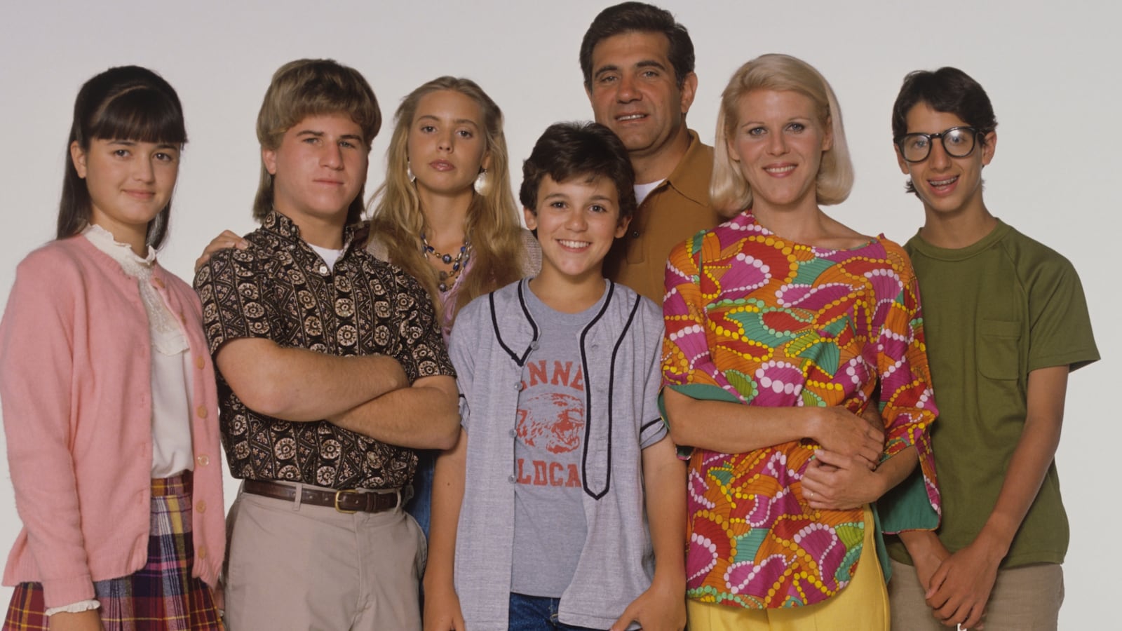 Danica McKellar, Jason Hervey, Olivia d'Abo, Fred Savage, Dan Lauria, Alley Mills, and Josh Saviano in The Wonder Years.